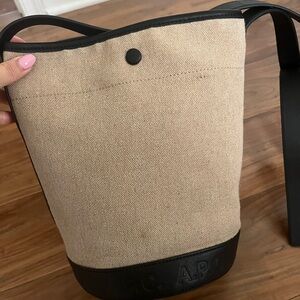 apc beige canvas helene crossbody bucket bag with black leather and logo